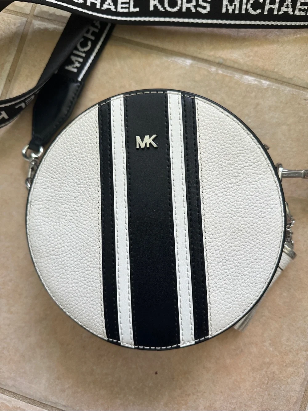 Michael Kors White Round Crossbody with Black Stripes and Branded Strap